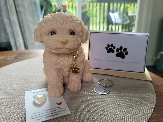 Plush dog toy with a tag and keychain on a table