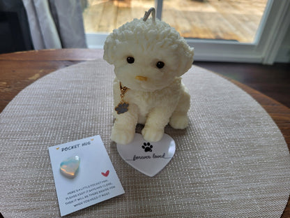Small white dog figurine with a heart-shaped tag on a textured surface